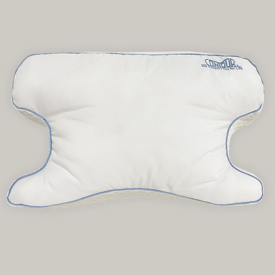 Vista superior de la almohada CPAP mostrando los recortes para la máscara y el hueco del hombro